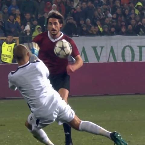 Burgundy & Black: Lifts the ball as the first challenge comes in.